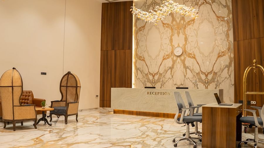 Image of Pride Elite Daman reception with a table and seating area.