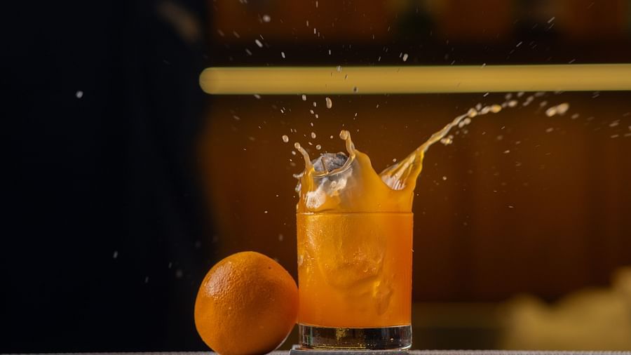 Image of a glass with jucie and a fruit beside the glass at Pride Elite Daman.