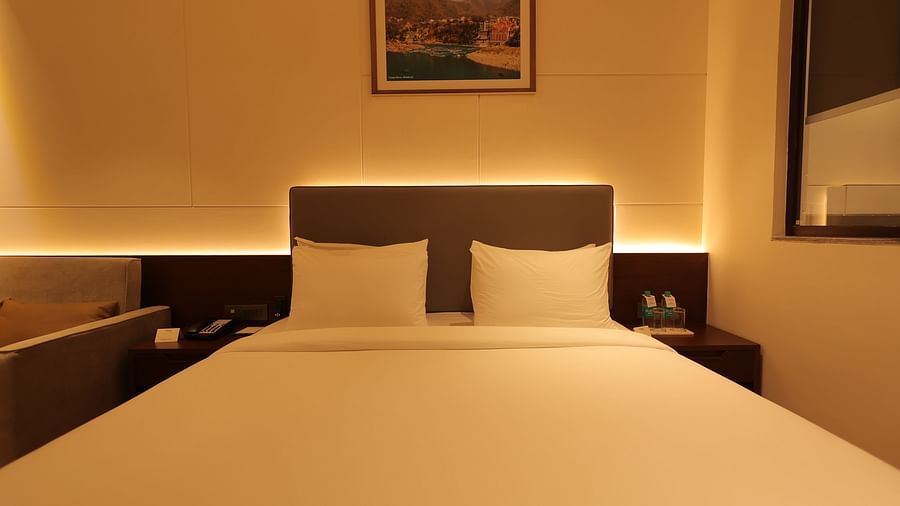 view of the king size bed of Deluxe Room at Pride Elite, Haridwar
