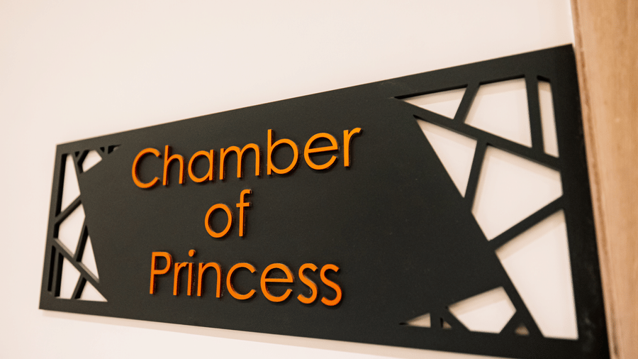 Pride Premier Alwar | A sign board with the dining name chamber of princess written on it.