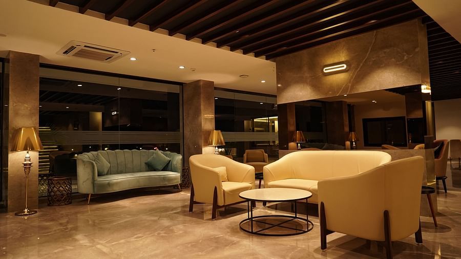 Pride Ranakpur Resort Convention Centre - Interior view of the reception area with cream and brown coloured interiors featuring multiple sofas