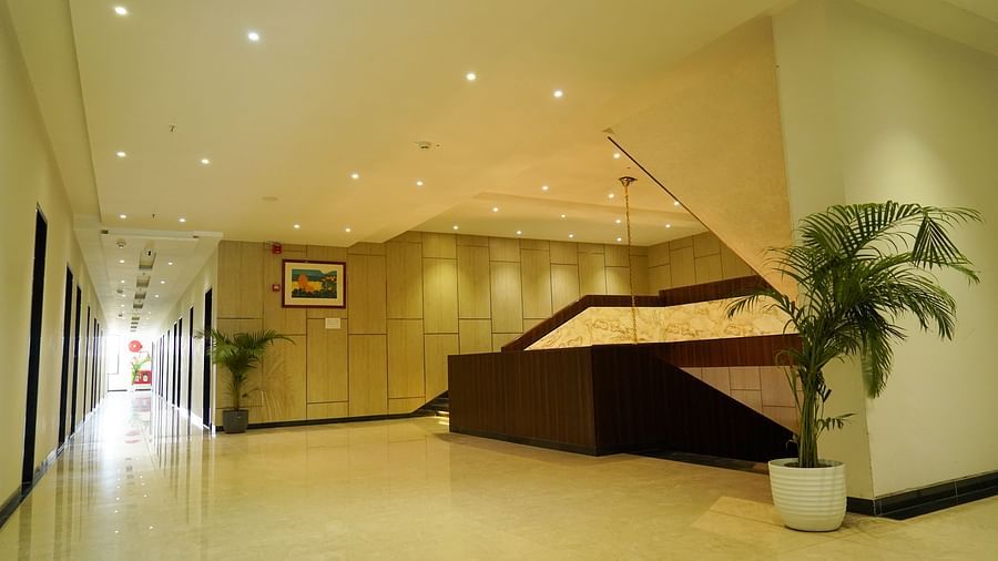Pride Ranakpur Resort Convention Centre - interior view of the property featuring a set of staircase and rooms illuminated in yellow coloured lights