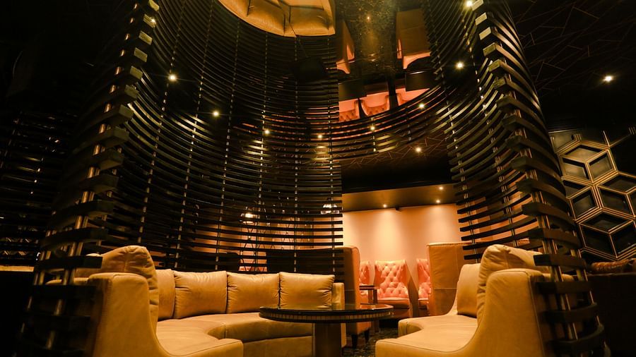 single seater sofas inside Lounge at Alchemy, our in-house bar in Chennai - Raj Park Hotel, Chennai
