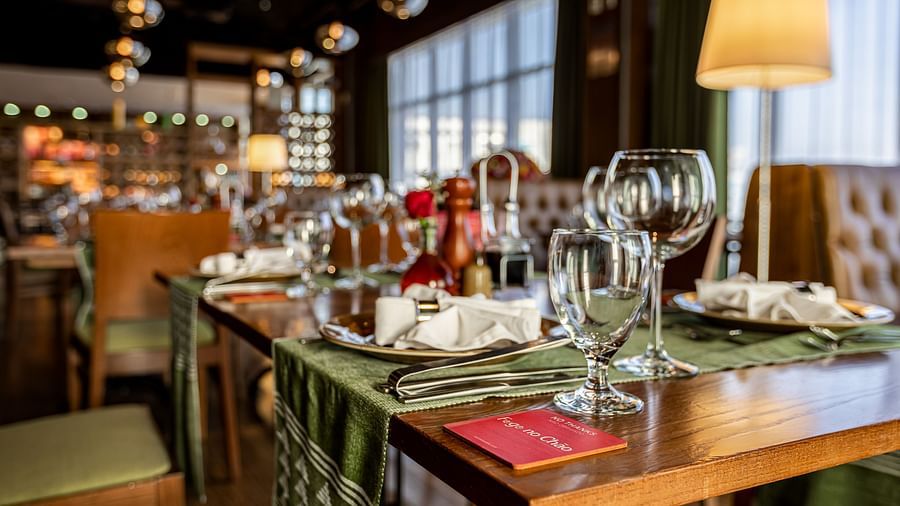 Restaurant table with plates and glass at our hotel in Addis Ababa