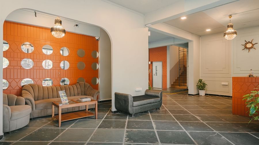 Lobby area of Richmonde Ananta Elite, Goa with a well-lit and elegantly designed space featuring comfortable seating.