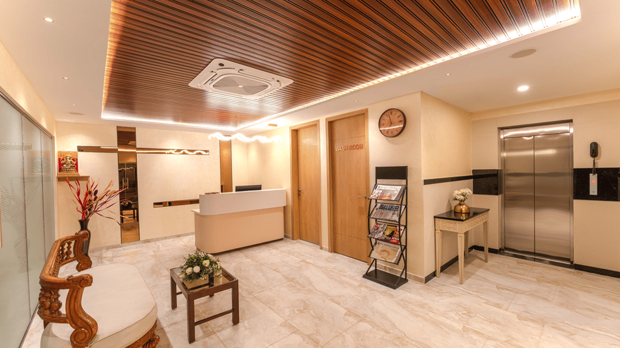 Spacious lobby featuring a combined seating and lounge area with warm ambient lighting at Rivido - Manyata