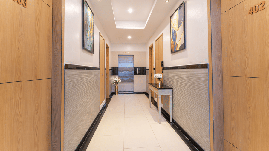 Bright and well-maintained hotel corridor with contemporary design at Rivido - Manyata