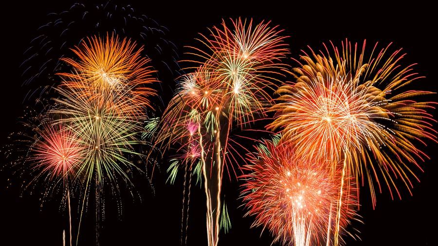 fireworks lighting up the night sky with different colours as seen from below