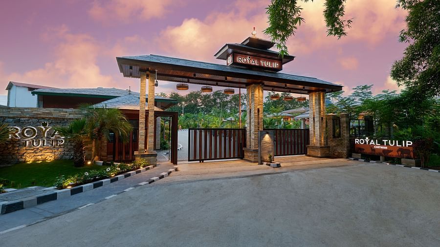The hotel entrance with a large archway and welcoming atmosphere - Royal Tulip, Chitwan