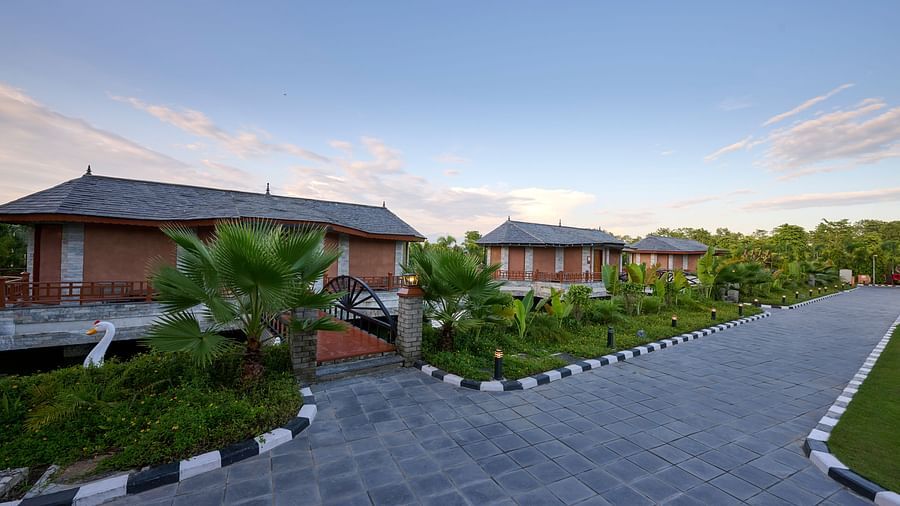 A wide angle shot of the pathway leading to accommodations at a hotel in Chitwan - Royal Tulip, Chitwan