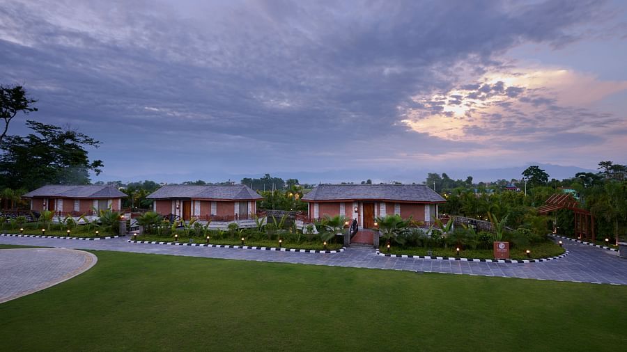 An aerial shot of accommodations at a hotel in Chitwan featuring a garden in front, seen during an evening - Royal Tulip, Chitwan