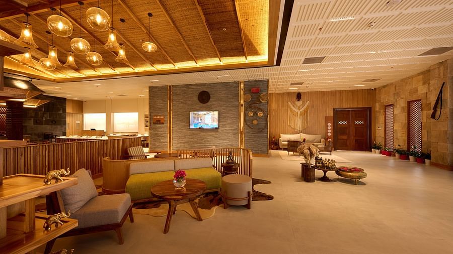 Hotel lobby with stylish seating, elegant lighting, and a modern, inviting atmosphere - Royal Tulip, Chitwan