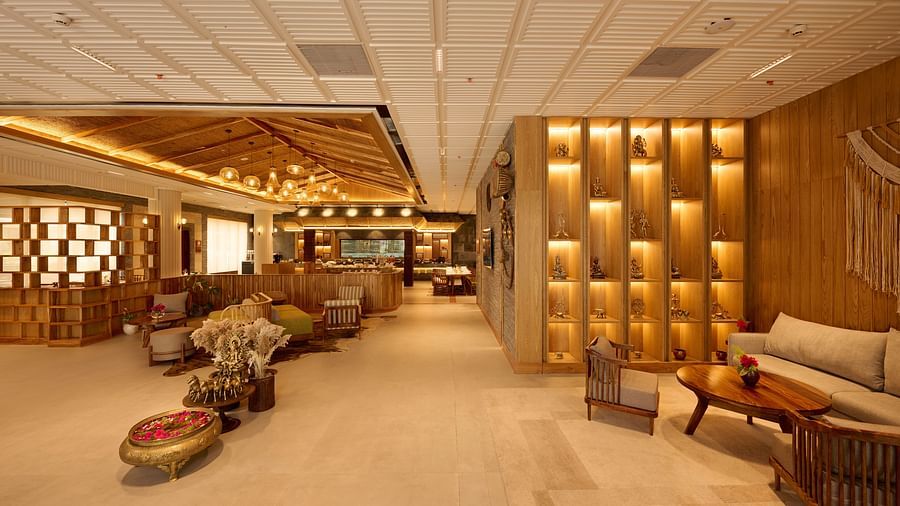 Hotel lobby area with a mix of traditional and modern furnishings and ambient lighting - Royal Tulip, Chitwan
