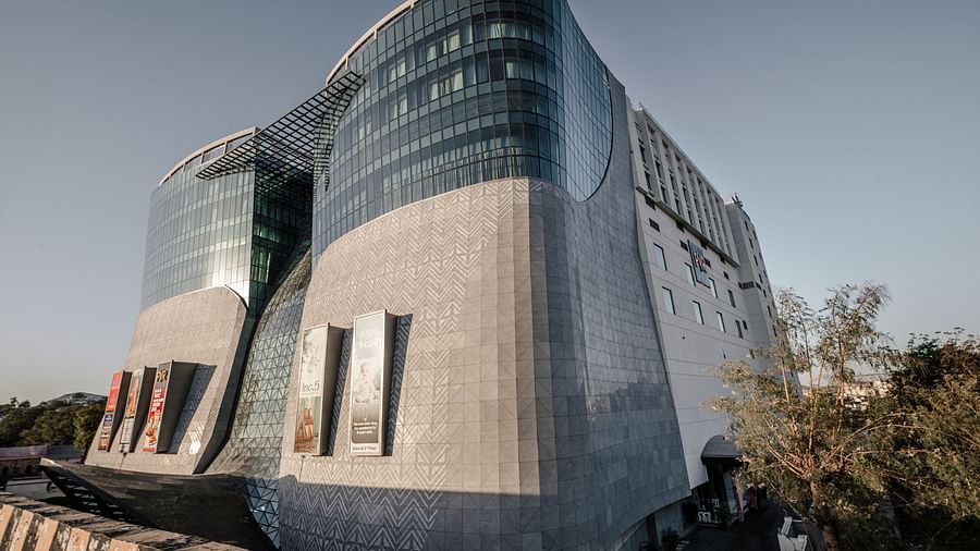 Architectural close-up of the curved glass façade at Sarovar Premiere, Udaipur