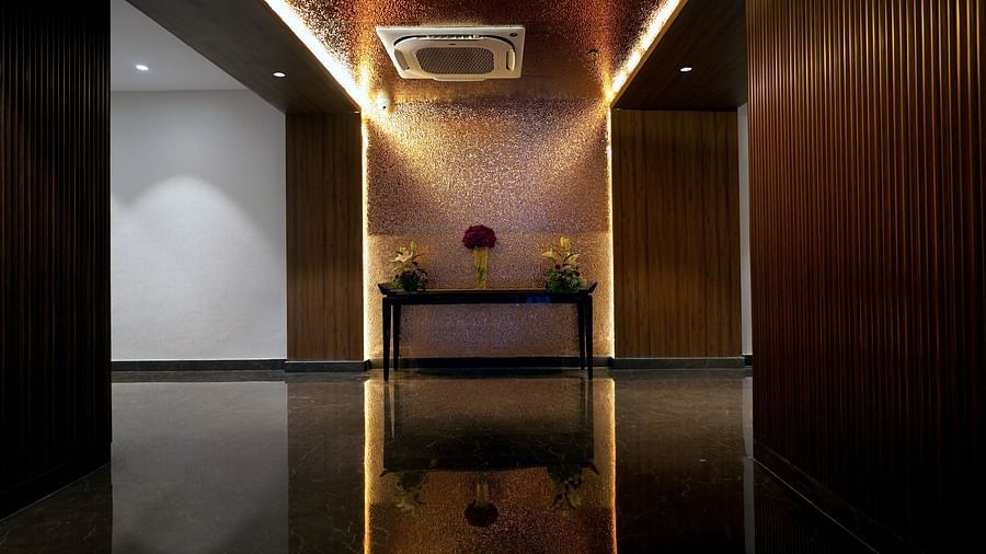 a sofa in a common waiting area at Sarovar Portico, Kolkata Rajarhat