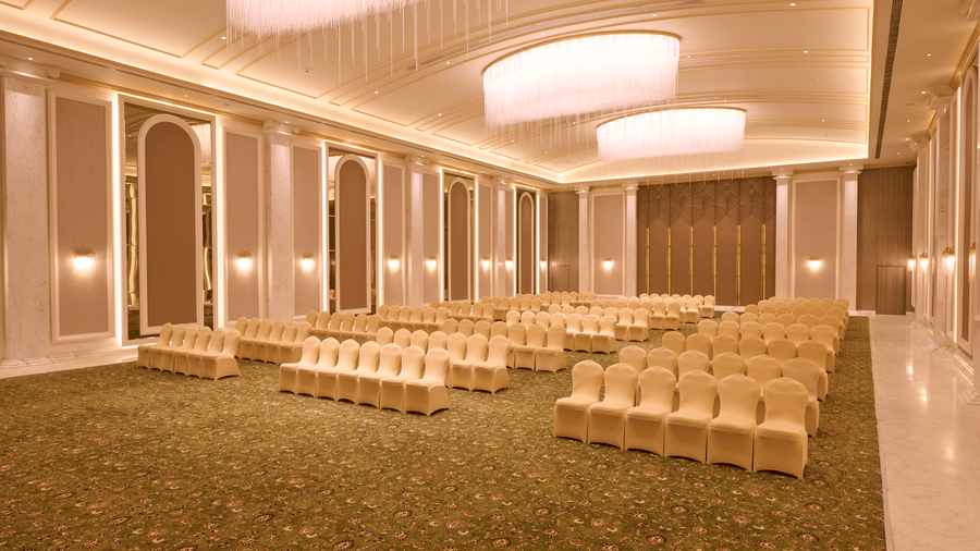 Banquet hall with rows of chairs set facing forward at Sarovar Premiere Amritsar.
