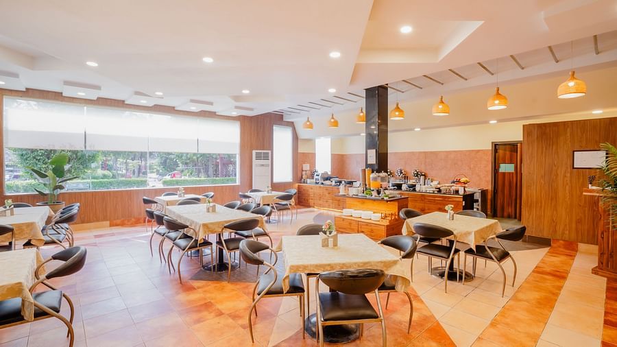 Guests enjoying a delicious meal at Shri Radha Brij Vasundhara Resort & Spa, Mathura