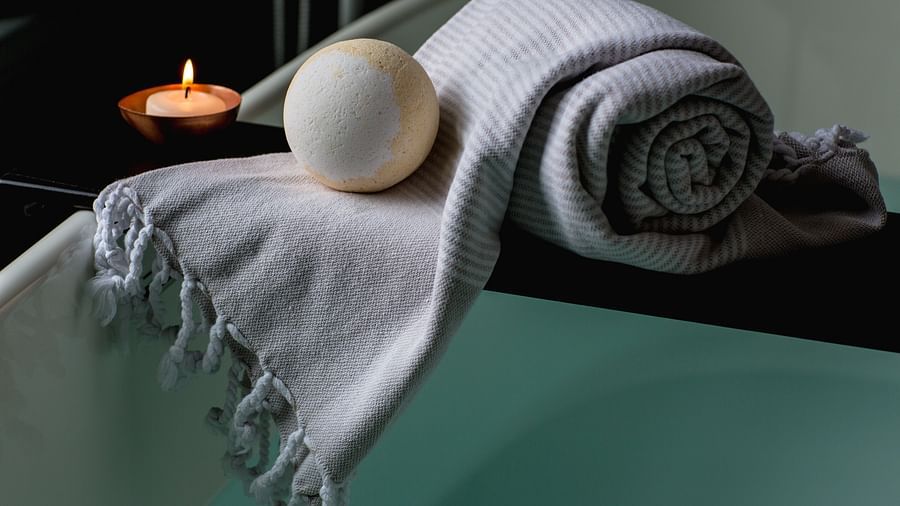 white-and-brown-bath-ball-on-grey-scarf-374032