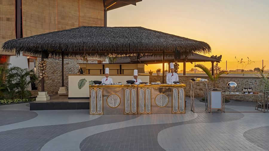 Brunch setup on the rooftop next to the swimming pool - Shyama Sarovar Portico Orai