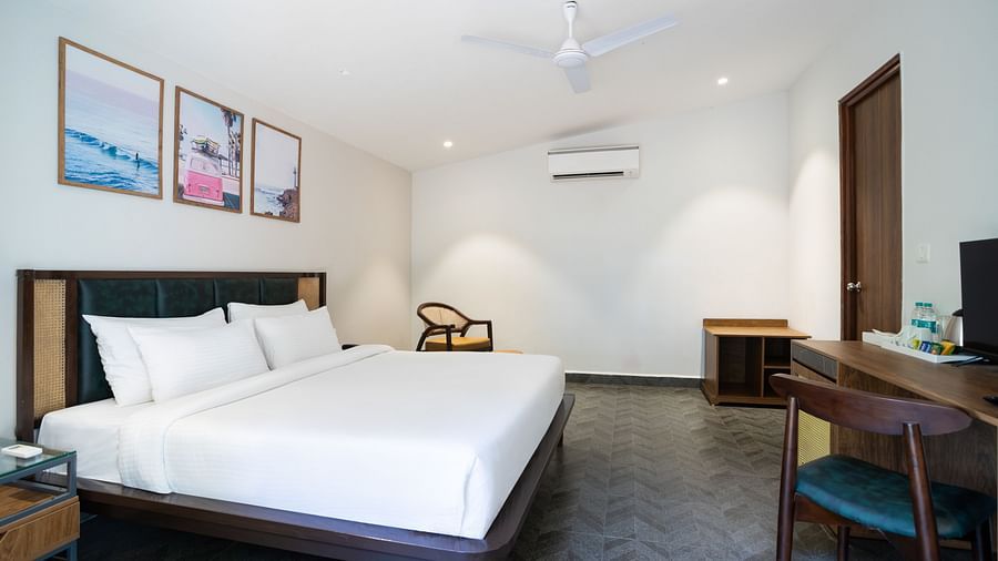 full view image of the topical classic cottage at sabaya beach resort , morjim beach featuring a queen size bed in the middle