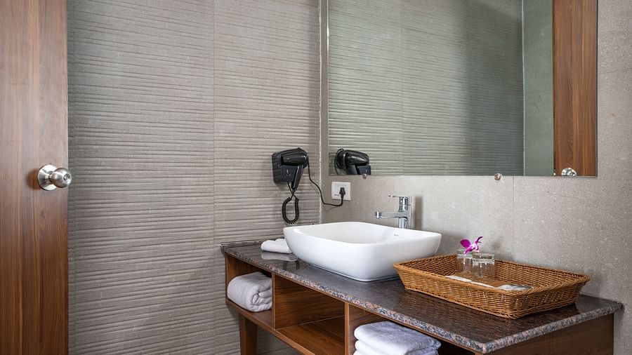 image of a the bathroom with an attached vanity area at the garden suite at Sibaya beach resort, morjim beach