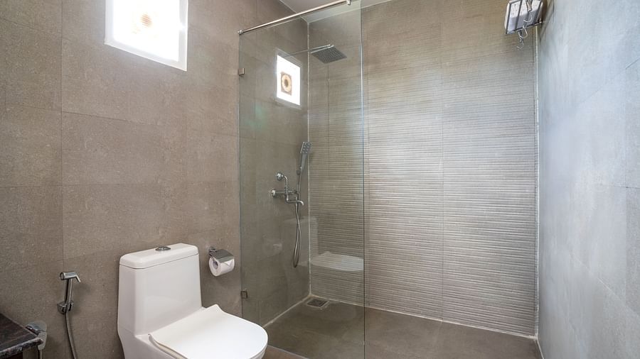 image of a the shower separated with a glass partition in the bathroom of the ocean suite