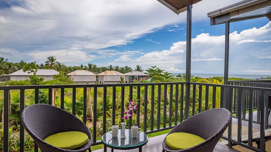 image of the private balcony featuring two chairs along with a coffee table with beautiful views from the balcony