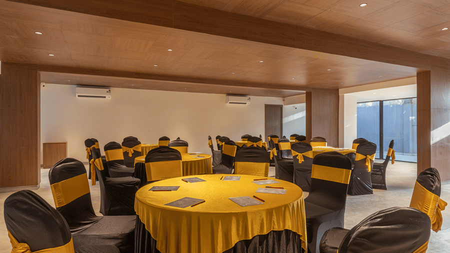 Event hall venue arranged with banquet table seating for conferences and celebrations at Sibaya Courtyard By Stone Wood Premier.