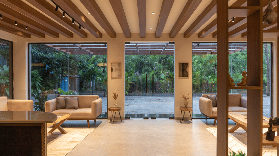 Spacious hotel reception and lobby area with warm wooden ceiling beams and comfortable seating at Sibaya Courtyard.