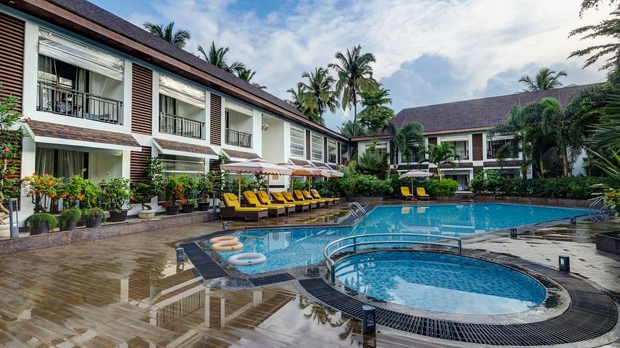 View of swimming pool at Sobit Sarovar Portico, Goa