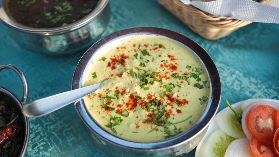 An Indian dish in a metal bowl | Sol Glow Resort, Nainital