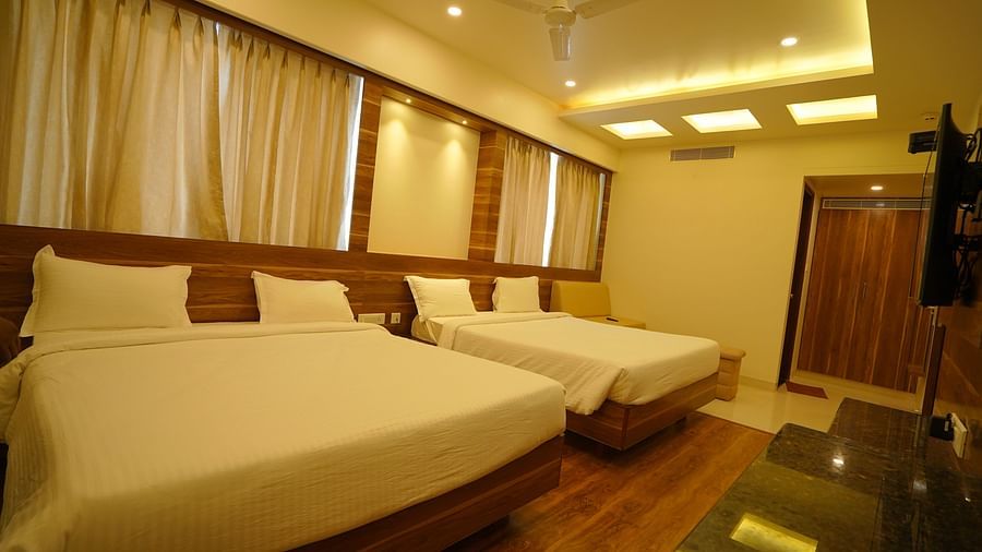 two double beds inside the premium family room - Springs Hotel Tirupati