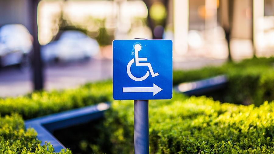 An image of a signboard with a wheelchair symbol on it