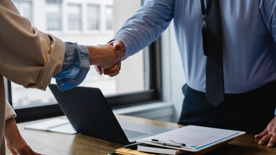 People shaking hands in a corporate setting