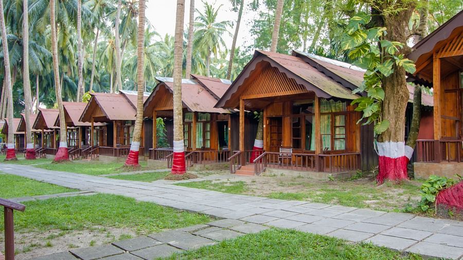 Wooden cottages built side by side at Symphony resorts in Andaman