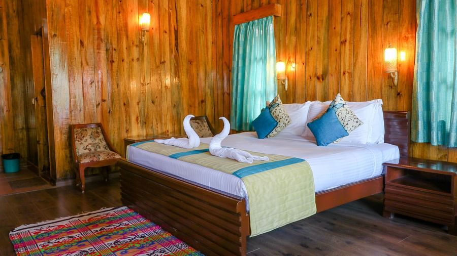 beautiful wooden interiors of one of the bedrooms in a Lagoon Suite at Symphony Palms, Havelock
