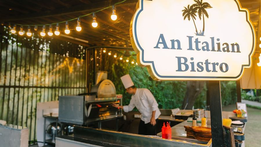An Italian Bistro Restaurant image with a person working in the open kitchen