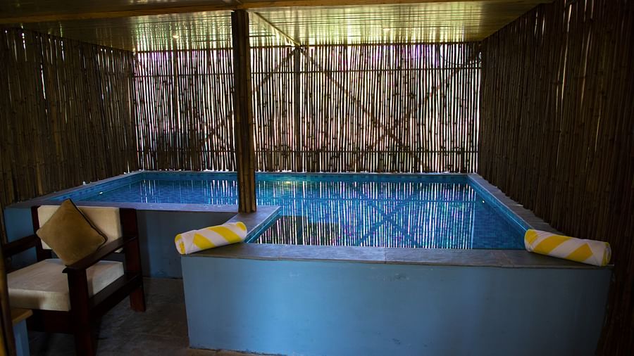 A small pool under a thatched roof