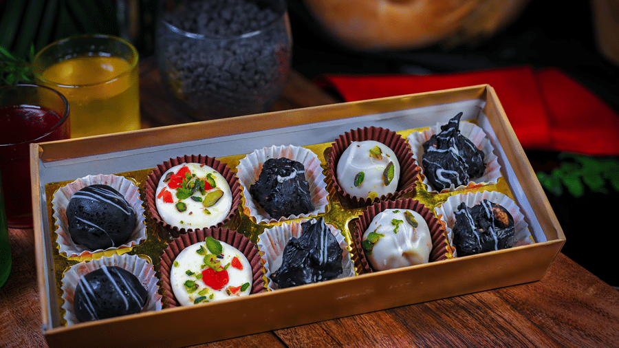 Several cupcakes placed on a plate at a dining space at Clarks Hotels.