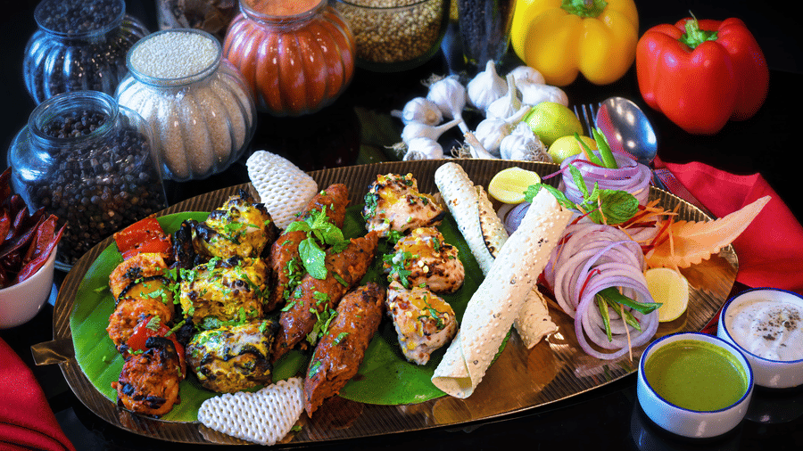 A platter placed on a plate at a dining space at Clarks Hotels.