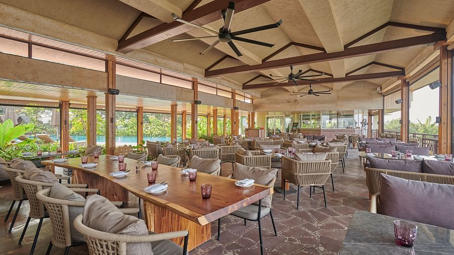 Dining space by the swimming pool with ceiling fans at The Dukes Retreat