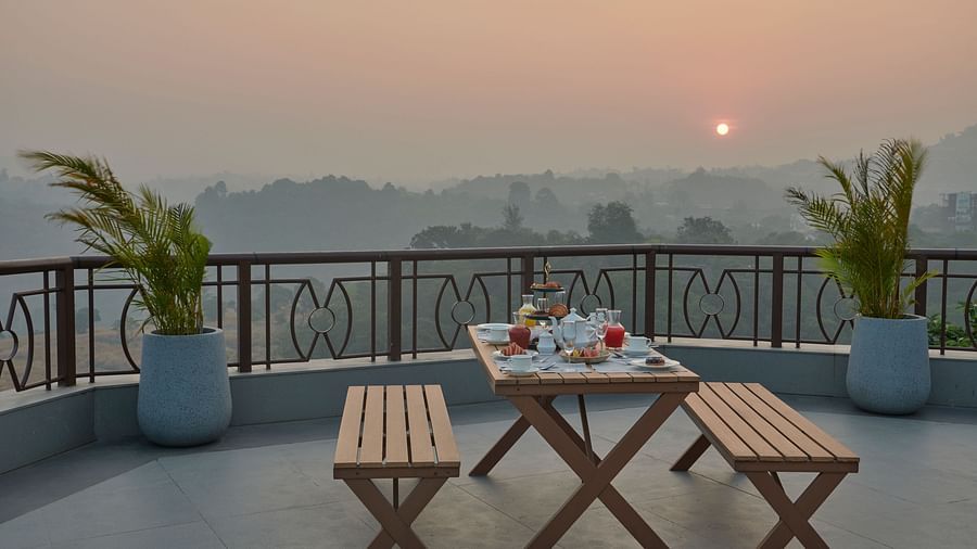 Sunrise breakfast at Sky Deck with panoramic views and seating arrangements at The Dukes Retreat