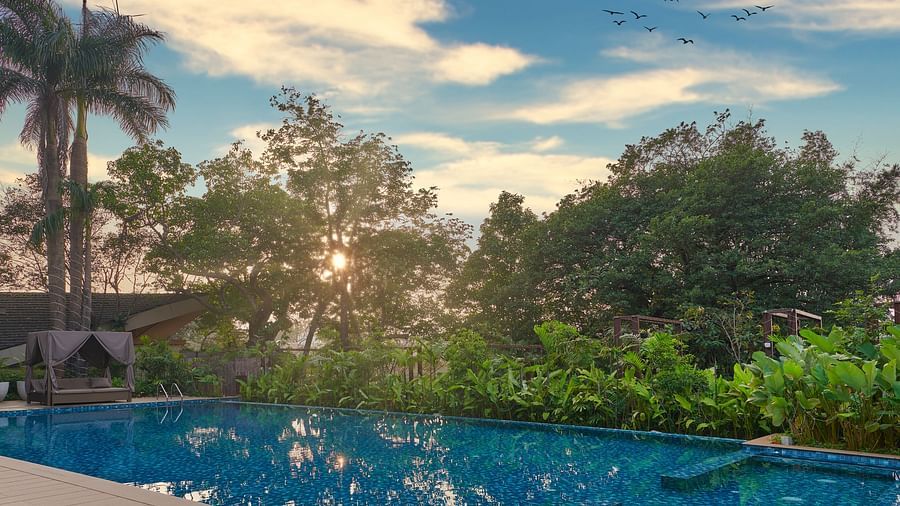 sunset view by the pool, with vibrant colours reflecting on the water at The Dukes Retreat