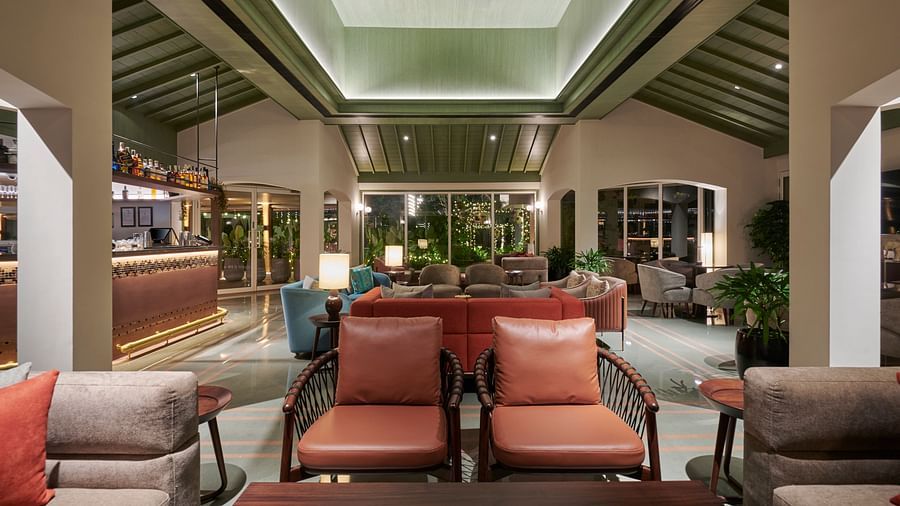 Bar seating area with stylish stools and a well-stocked bar in a modern setting at The Dukes Retreat