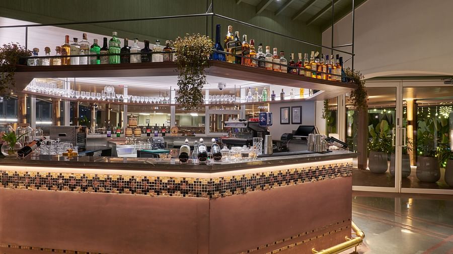 Well-stocked bar with a variety of bottles neatly arranged on shelves at The Dukes Retreat
