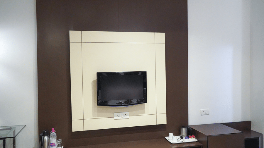 Wall-mounted television in the Executive Room of Sarovar Portico, Bhubaneswar.