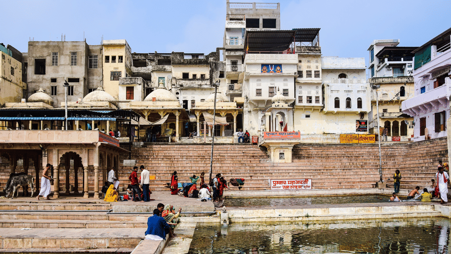 Facade of the buildings with a water body right below it.