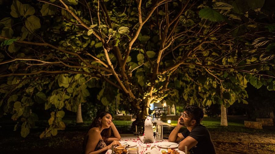 a couple on a romantic candle light dinner date