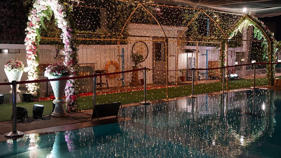 Floral wedding arch over a poolside setting at The Orchid Hotel Mumbai Vile Parle