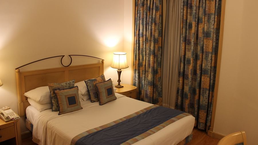 room with king size bed and warm lighting
